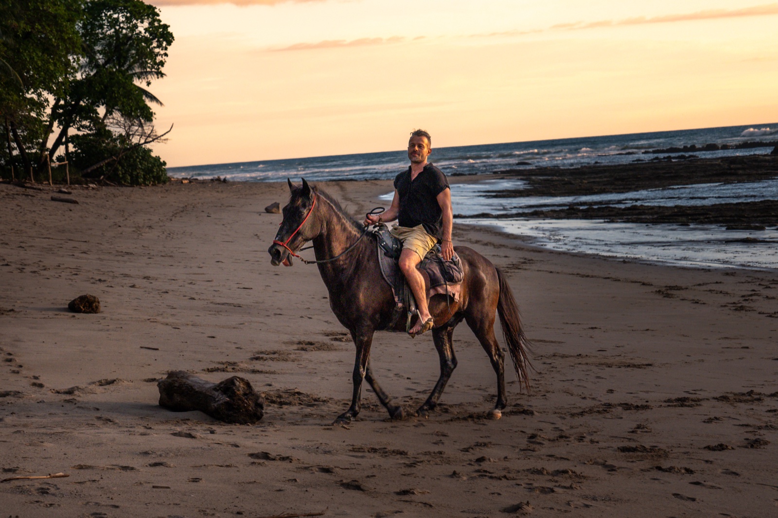 Horseback on a Costa Rica beach at sunset