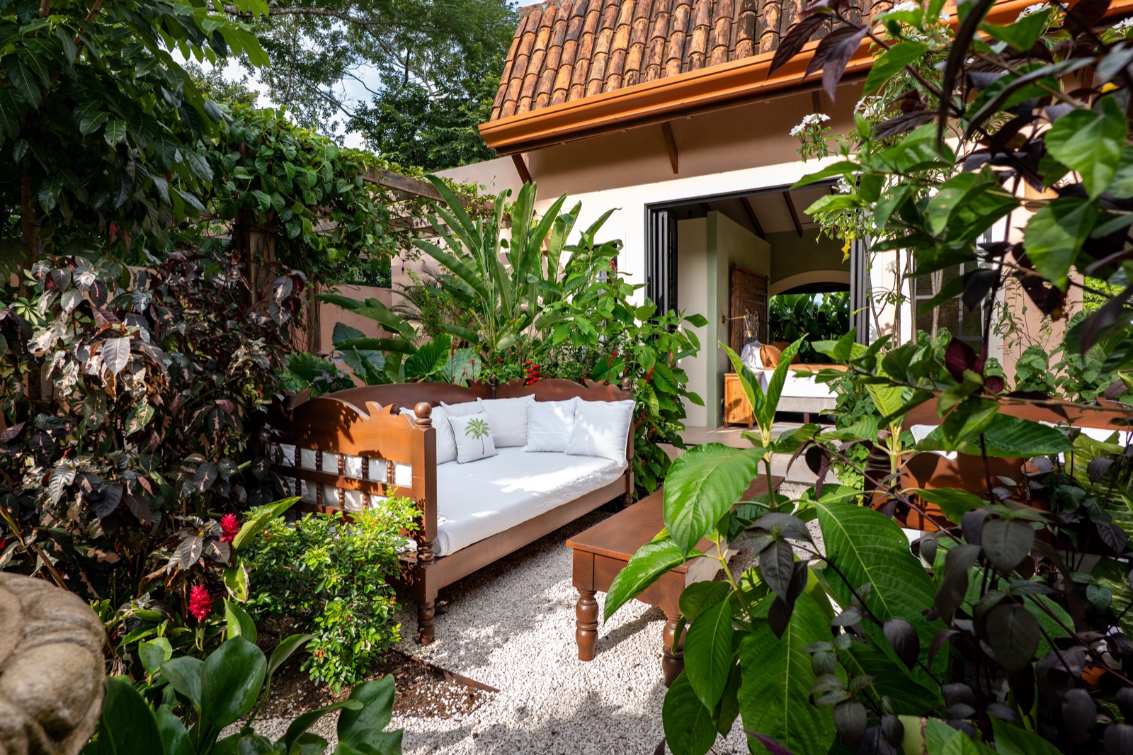 Tropical garden patio with seating area