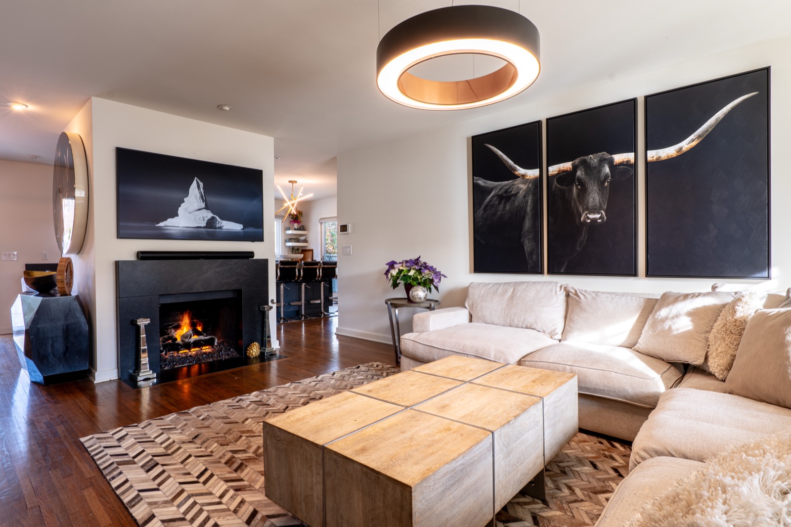 Modern living room with fireplace and art