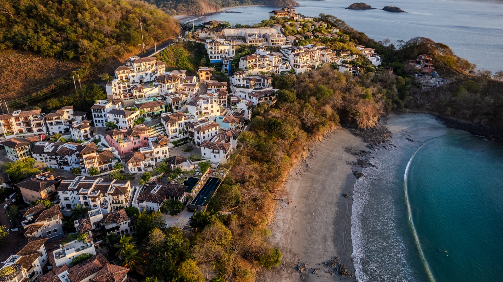 Aerial view of coastal hillside town and beach