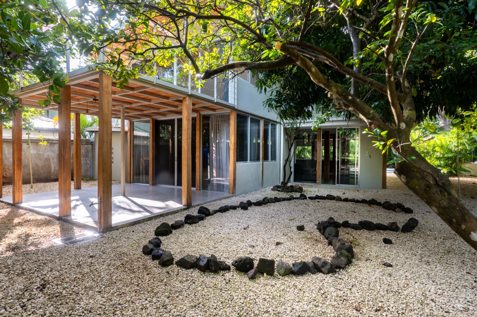 Open kitchen and living area with copper pendant lights