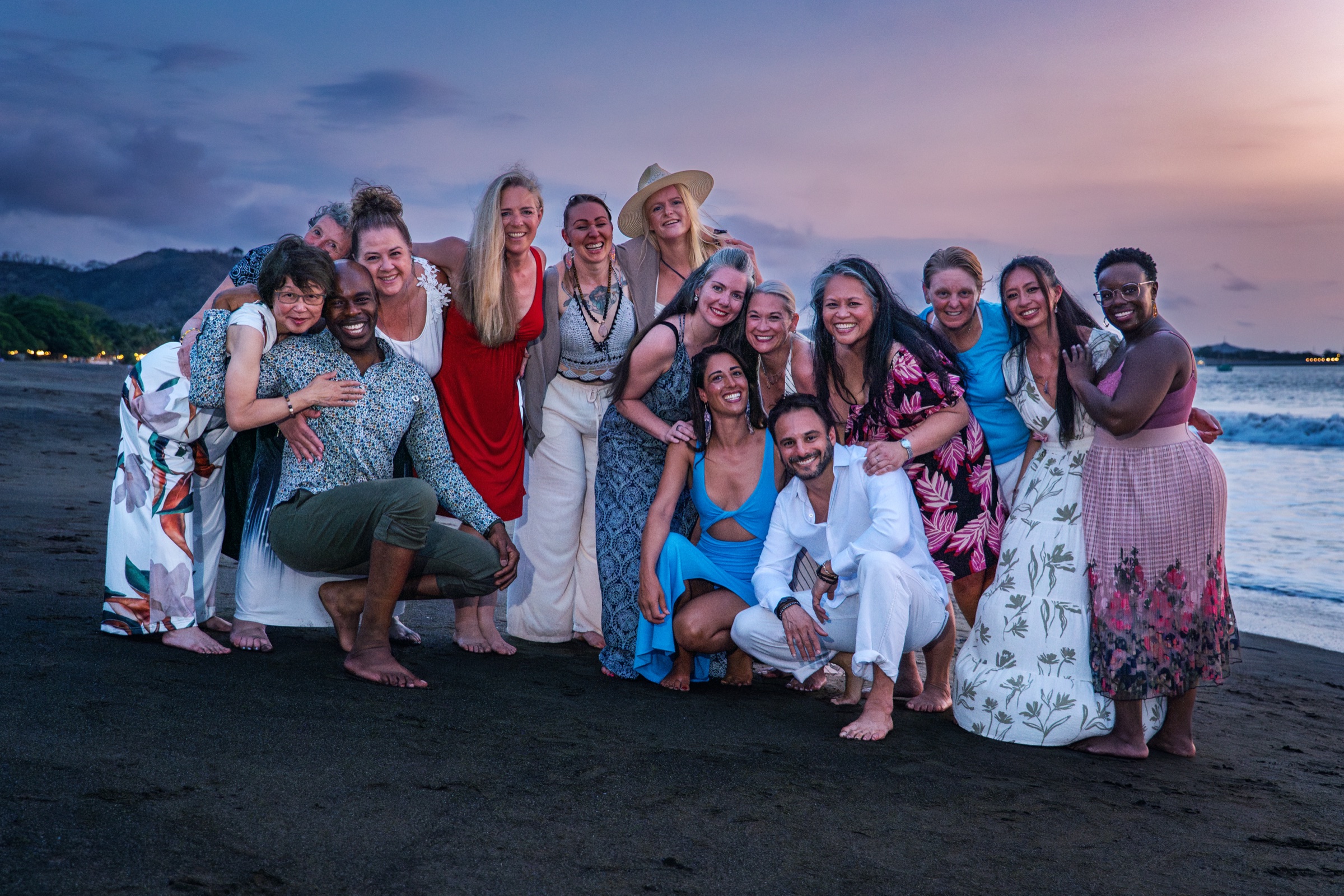 Retreat group on the beach at sunset